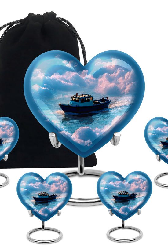 Steel Blue Boat Cremation Urn close-up of engraving and surface detail - romantic heart urn with boat motif on aluminum - memorial set with one large and four small urns