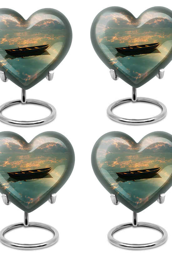 Dark Black Boat Cremation Urn angled view of lid and engraved motif - compassionate heart-boat combination with gentle curves - 10 inch aluminum urn for cremated remains