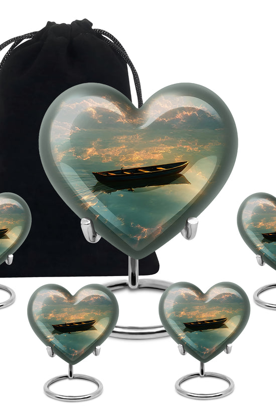 Onyx Black Boat Cremation Urn close-up of engraving and surface detail - romantic heart urn with boat motif on aluminum - memorial set with one large and four small urns