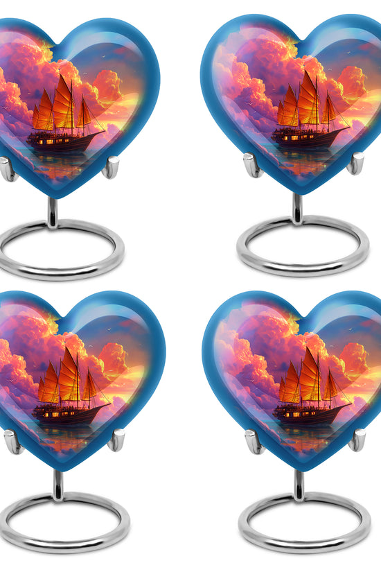 Royal Blue Boat Cremation Urn angled view of lid and engraved motif - compassionate heart-boat combination with gentle curves - 10 inch aluminum urn for cremated remains