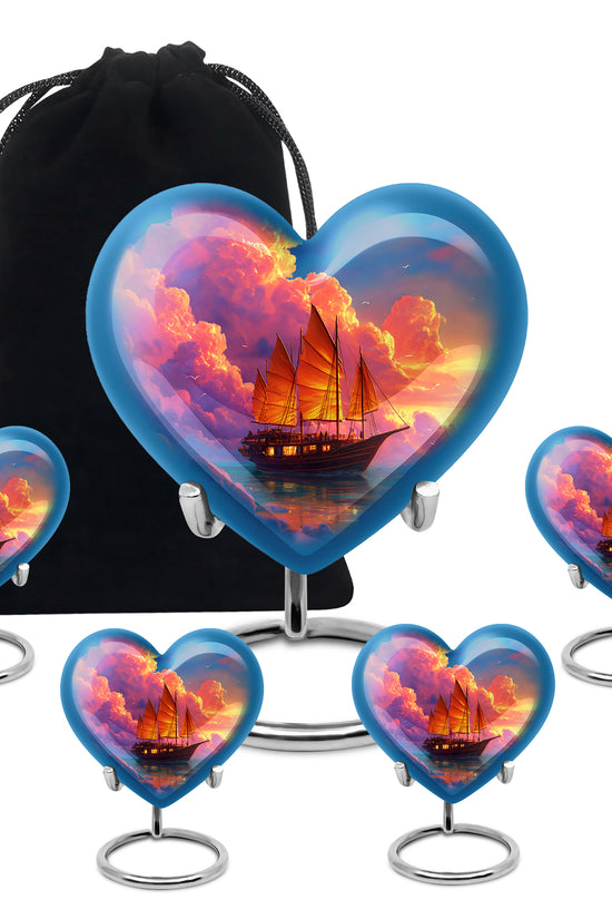 Navy Blue Boat Cremation Urn close-up of engraving and surface detail - heart-shaped boat design symbolizing eternal love - memorial set with one large and four small urns