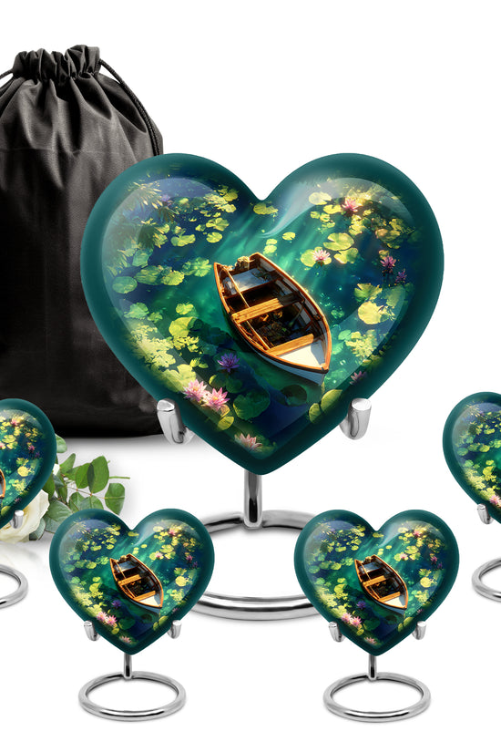 Dusty Blue Boat Cremation Urn close-up of engraving and surface detail - loving heart memorial featuring boat pattern - memorial set with one large and four small urns
