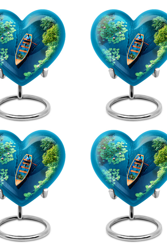Aqua Teal Boat Cremation Urn angled view of lid and engraved motif - compassionate heart-boat combination with gentle curves - 10 inch aluminum urn for cremated remains