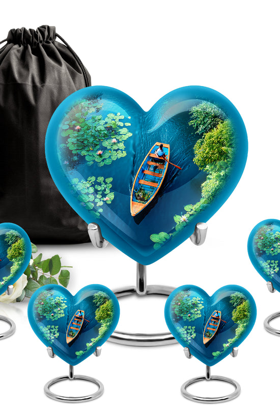 Soft Teal Boat Cremation Urn close-up of engraving and surface detail - loving heart memorial featuring boat pattern - memorial set with one large and four small urns