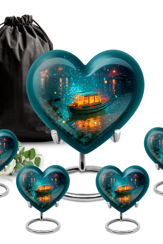 Tropical Teal Boat Cremation Urn close-up of engraving and surface detail - romantic heart urn with boat motif on aluminum - memorial set with one large and four small urns