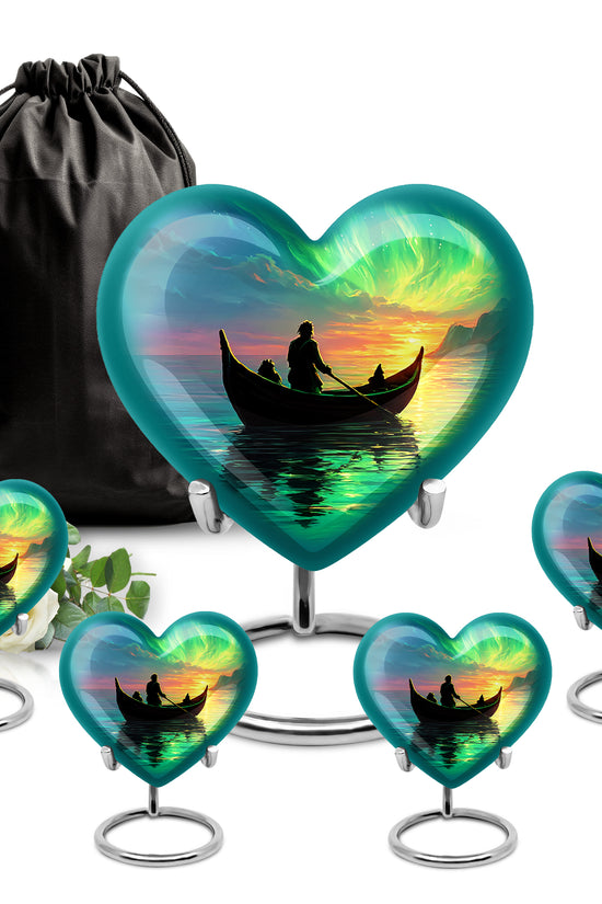 Indigo Boat Cremation Urn close-up of engraving and surface detail - heart-shaped boat design symbolizing eternal love - memorial set with one large and four small urns