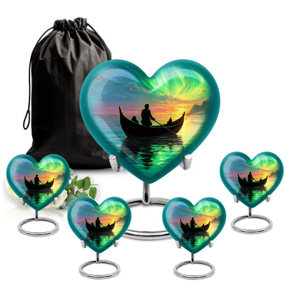 Indigo Boat Cremation Urn close-up of engraving and surface detail - heart-shaped boat design symbolizing eternal love - memorial set with one large and four small urns
