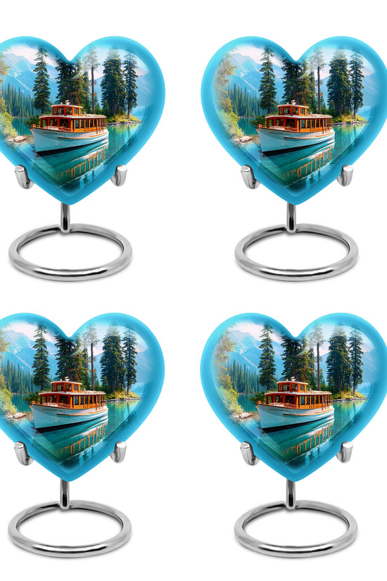 Soft Blue Boat Cremation Urn angled view of lid and engraved motif - compassionate heart-boat combination with gentle curves - 10 inch aluminum urn for cremated remains
