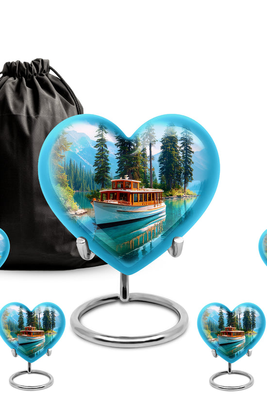 Slate Blue Boat Cremation Urn close-up of engraving and surface detail - heart-shaped boat design symbolizing eternal love - memorial set with one large and four small urns