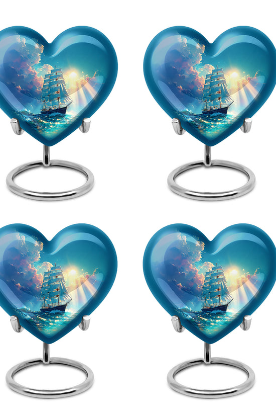 Ocean Teal Boat Cremation Urn angled view of lid and engraved motif - loving heart memorial featuring boat pattern - 10 inch aluminum urn for cremated remains