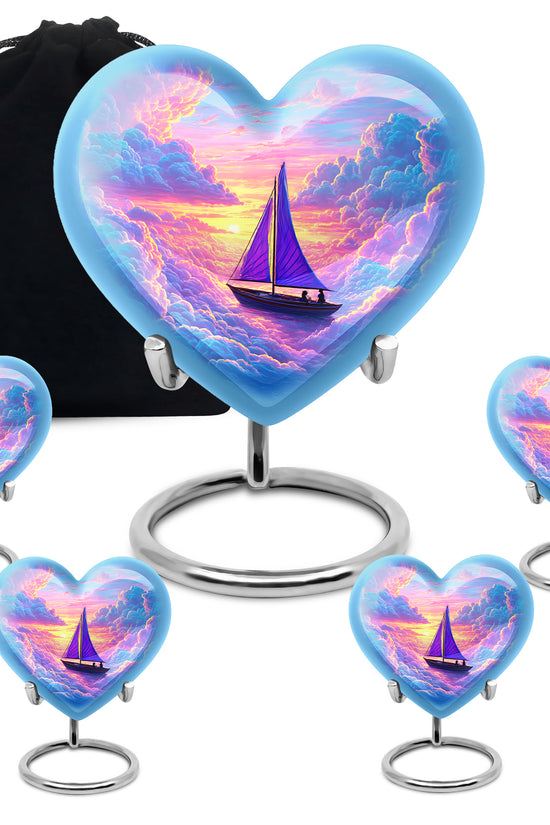 Sapphire Blue Boat Cremation Urn close-up of engraving and surface detail - romantic heart urn with boat motif on aluminum - memorial set with one large and four small urns