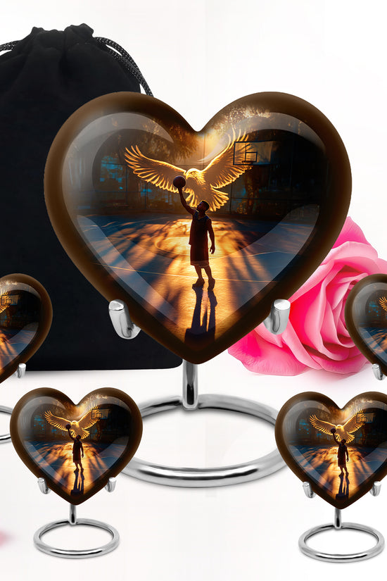 Rich Black Basketball Cremation Urn close-up of engraving and surface detail - heart-shaped basketball design symbolizing eternal love - memorial set with one large and four small urns