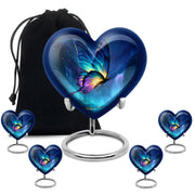 Vivid Blue Butterfly Cremation Urn close-up of engraving and surface detail - compassionate heart-butterfly combination with gentle curves - memorial set with one large and four small urns
