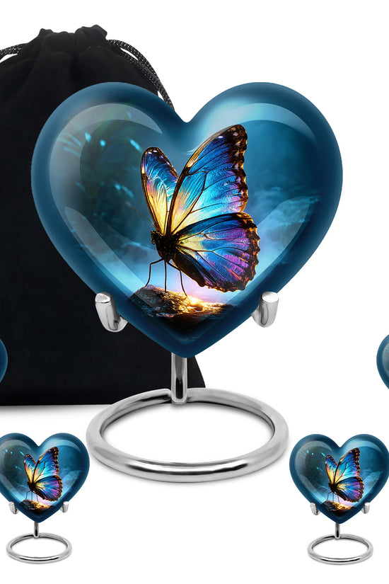 Indigo Butterfly Cremation Urn close-up of engraving and surface detail - heart-shaped butterfly design symbolizing eternal love - memorial set with one large and four small urns
