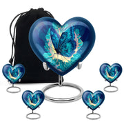 Calming Blue Butterfly Cremation Urn close-up of engraving and surface detail - romantic heart urn with butterfly motif on aluminum - memorial set with one large and four small urns