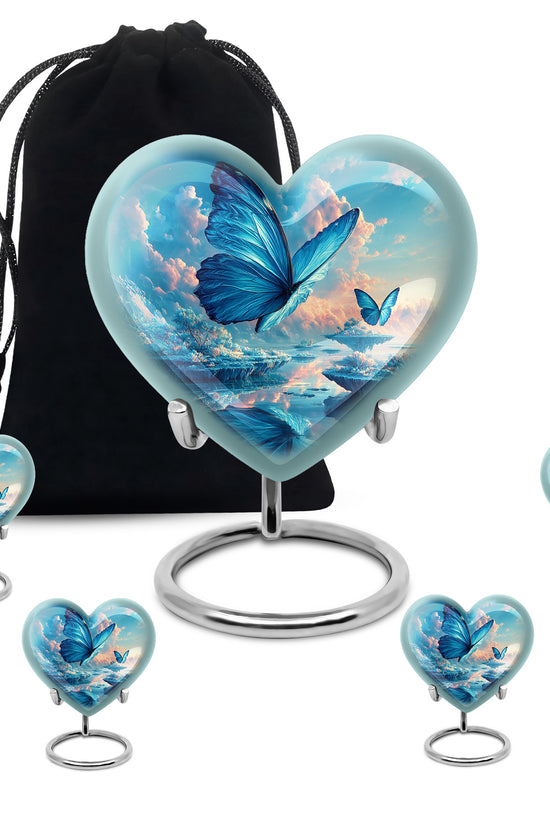 Soft Blue Butterfly Cremation Urn close-up of engraving and surface detail - compassionate heart-butterfly combination with gentle curves - memorial set with one large and four small urns