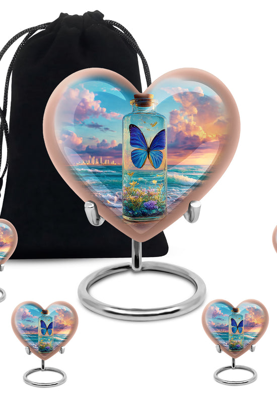 Sapphire Blue Butterfly Cremation Urn close-up of engraving and surface detail - compassionate heart-butterfly combination with gentle curves - memorial set with one large and four small urns