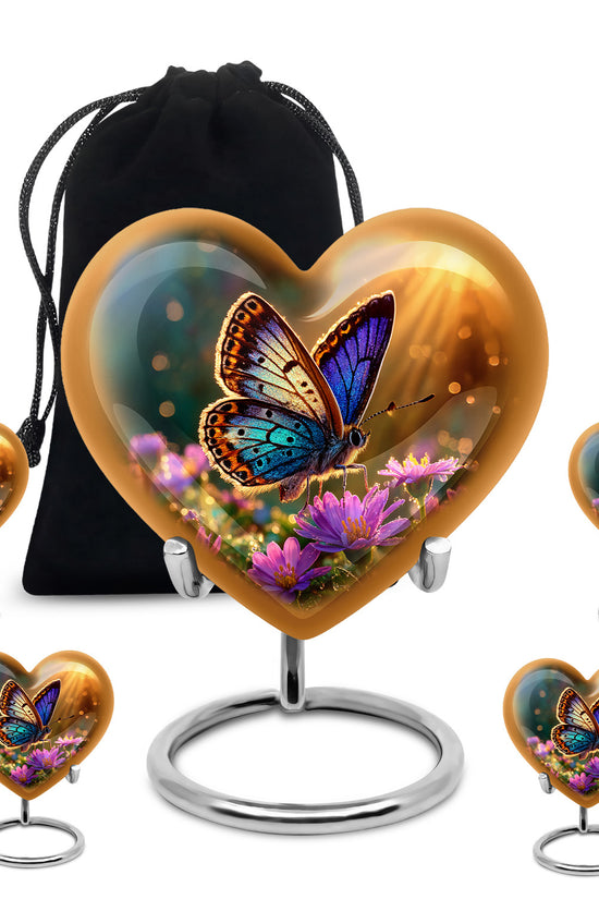 Gilded Gold Butterfly Cremation Urn close-up of engraving and surface detail - heart-shaped butterfly design symbolizing eternal love - memorial set with one large and four small urns