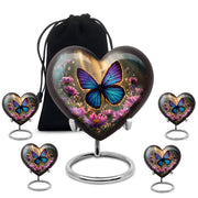 Matte Gold Butterfly Cremation Urn close-up of engraving and surface detail - romantic heart urn with butterfly motif on aluminum - memorial set with one large and four small urns