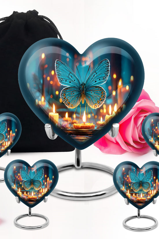 Calming Blue Butterfly Cremation Urn close-up of engraving and surface detail - romantic heart urn with butterfly motif on aluminum - memorial set with one large and four small urns