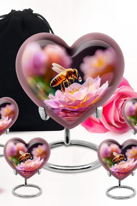 Onyx Black Bee Cremation Urn close-up of engraving and surface detail - romantic heart urn with bee motif on aluminum - memorial set with one large and four small urns