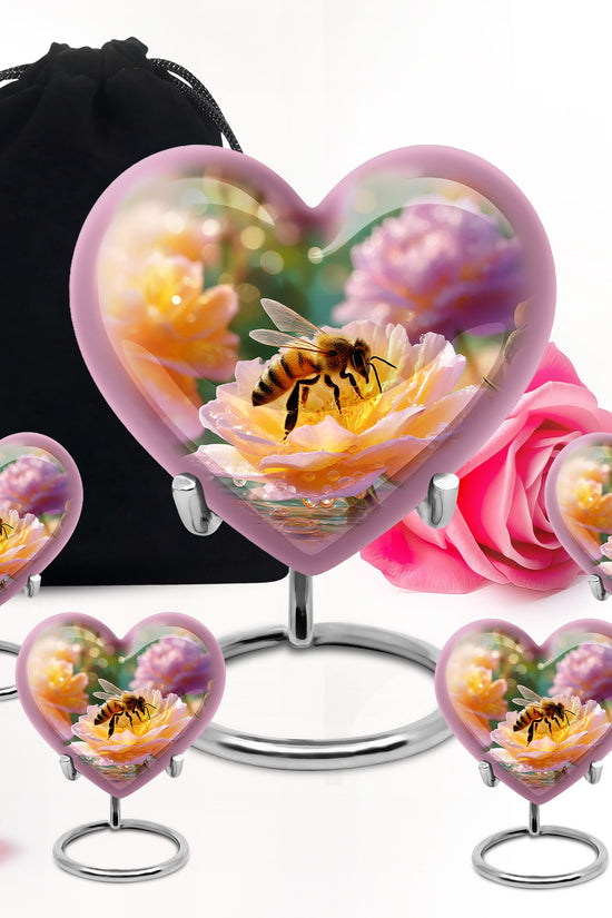 Harvest Gold Bee Cremation Urn close-up of engraving and surface detail - compassionate heart-bee combination with gentle curves - memorial set with one large and four small urns