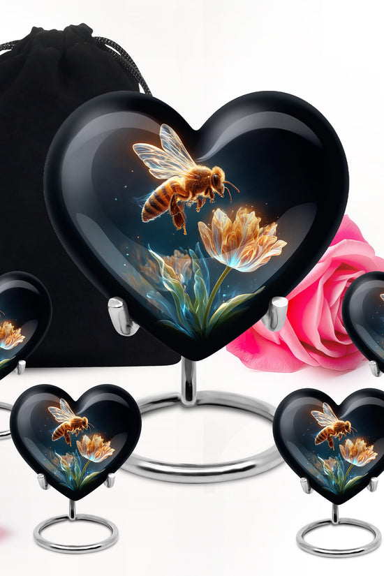 Deep Black Bee Cremation Urn close-up of engraving and surface detail - heart-shaped bee design symbolizing eternal love - memorial set with one large and four small urns