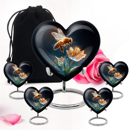 Deep Black Bee Cremation Urn close-up of engraving and surface detail - heart-shaped bee design symbolizing eternal love - memorial set with one large and four small urns