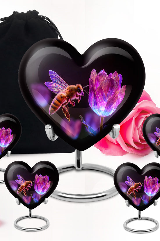 Obsidian Black Bee Cremation Urn close-up of engraving and surface detail - compassionate heart-bee combination with gentle curves - memorial set with one large and four small urns
