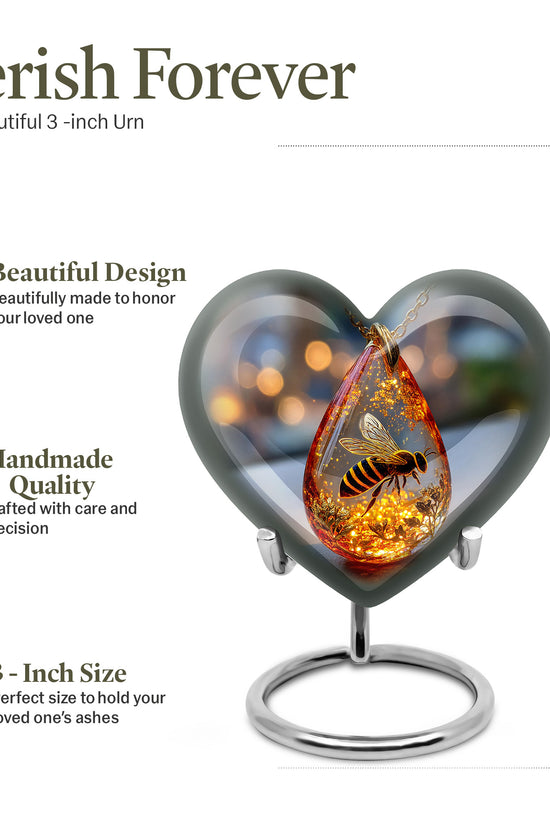 Onyx Black Bee Cremation Urn front view showing detailed design - compassionate heart-bee combination with gentle curves - mini keepsake memorial for portion of cremation ashes