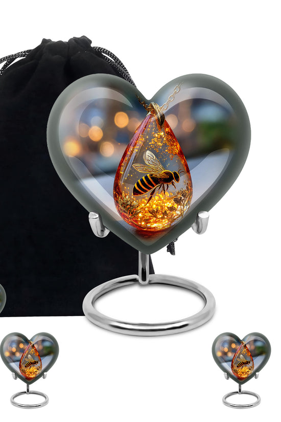 Obsidian Black Bee Cremation Urn close-up of engraving and surface detail - romantic heart urn with bee motif on aluminum - memorial set with one large and four small urns