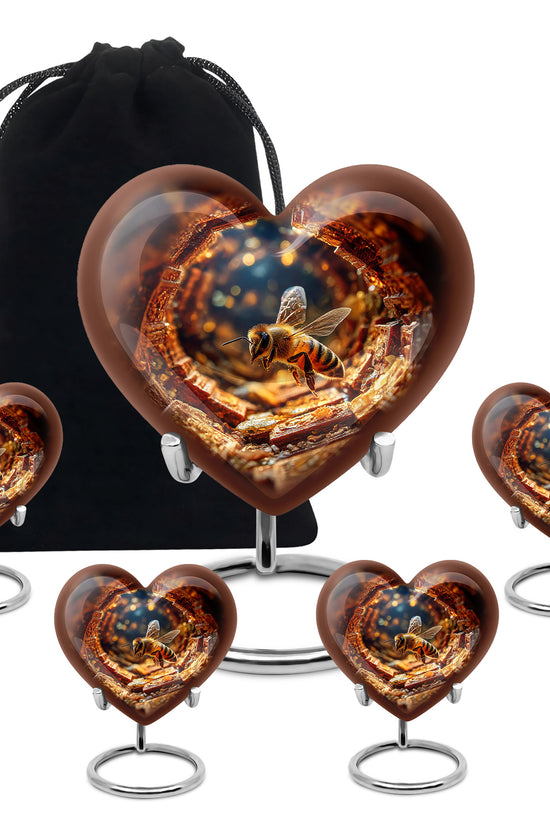 Deep Red Bee Cremation Urn close-up of engraving and surface detail - heart-shaped bee design symbolizing eternal love - memorial set with one large and four small urns