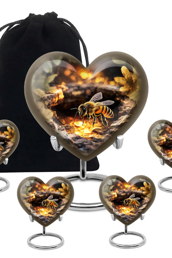 Matte Gold Bee Cremation Urn close-up of engraving and surface detail - romantic heart urn with bee motif on aluminum - memorial set with one large and four small urns