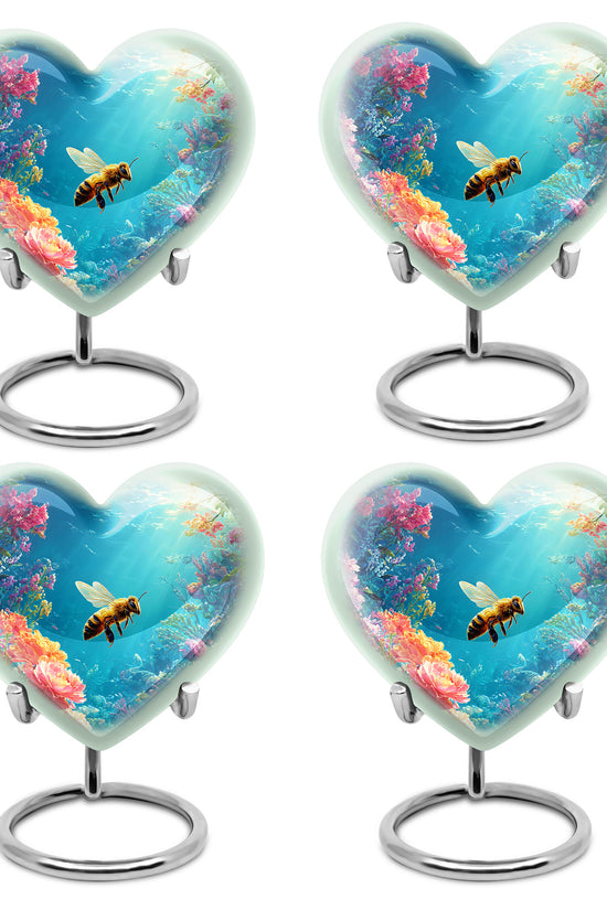 Dusty Blue Bee Cremation Urn angled view of lid and engraved motif - heart-shaped bee design symbolizing eternal love - 10 inch aluminum urn for cremated remains