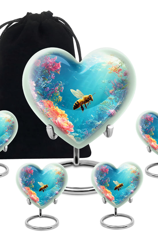 Powder Blue Bee Cremation Urn close-up of engraving and surface detail - heart-shaped bee design symbolizing eternal love - memorial set with one large and four small urns
