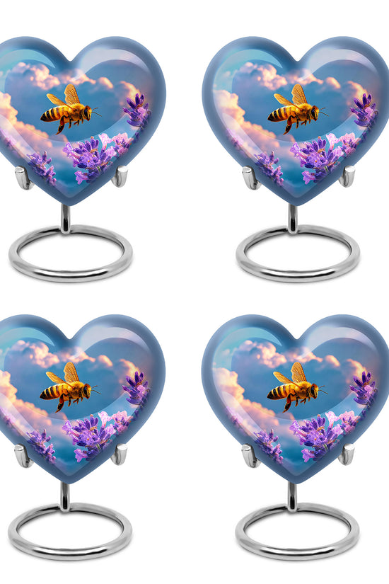 Dusty Blue Bee Cremation Urn angled view of lid and engraved motif - heart-shaped bee design symbolizing eternal love - 10 inch aluminum urn for cremated remains