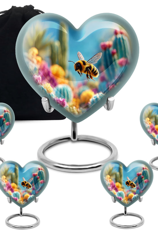Bright Blue Bee Cremation Urn close-up of engraving and surface detail - romantic heart urn with bee motif on aluminum - memorial set with one large and four small urns