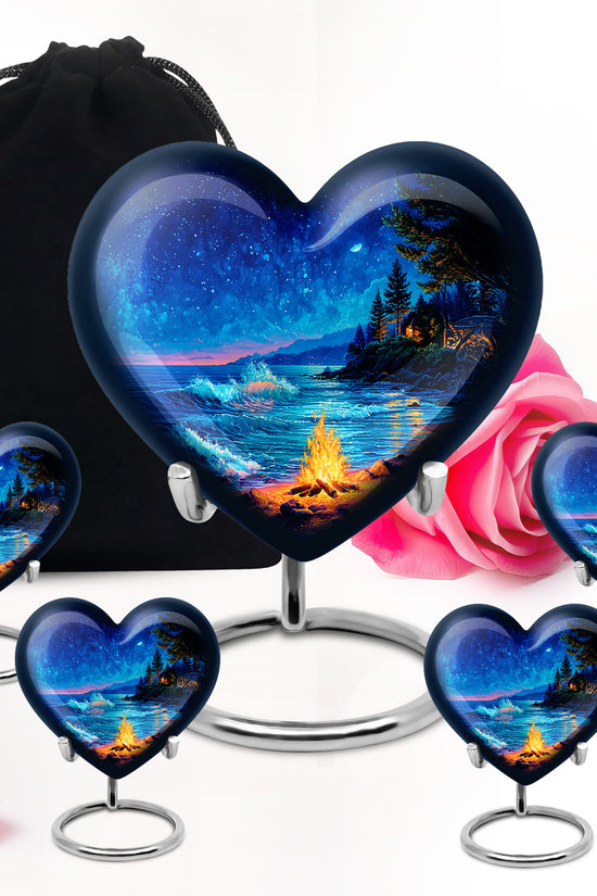 Soft Blue Campfire Cremation Urn close-up of engraving and surface detail - romantic heart urn with campfire motif on aluminum - memorial set with one large and four small urns