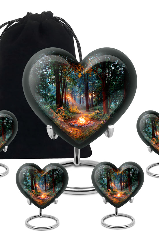 Jet Black Campfire Cremation Urn close-up of engraving and surface detail - heart-shaped campfire design symbolizing eternal love - memorial set with one large and four small urns