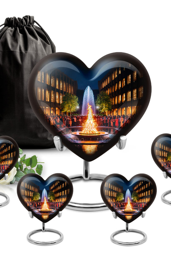 Ebony Campfire Cremation Urn close-up of engraving and surface detail - heart-shaped campfire design symbolizing eternal love - memorial set with one large and four small urns