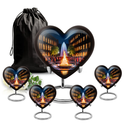 Ebony Campfire Cremation Urn close-up of engraving and surface detail - heart-shaped campfire design symbolizing eternal love - memorial set with one large and four small urns