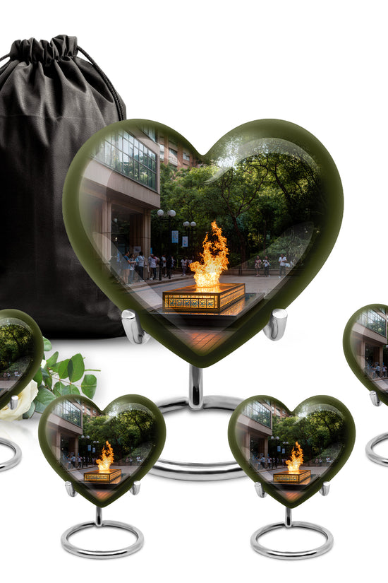 Midnight Black Campfire Cremation Urn close-up of engraving and surface detail - compassionate heart-campfire combination with gentle curves - memorial set with one large and four small urns