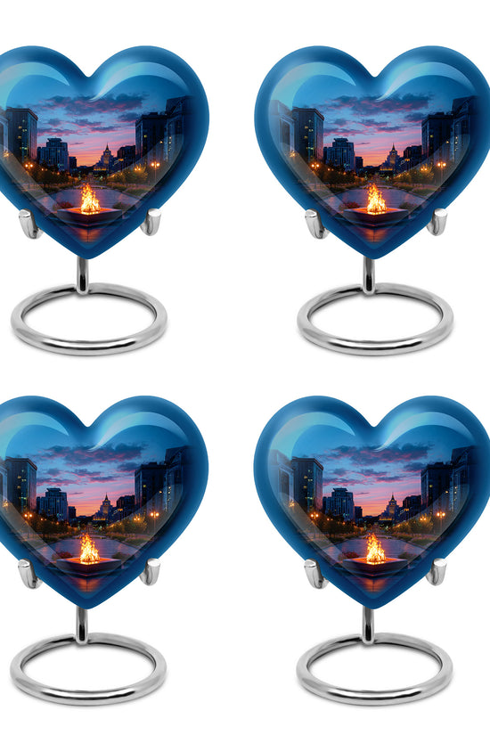 Soft Blue Campfire Cremation Urn angled view of lid and engraved motif - compassionate heart-campfire combination with gentle curves - 10 inch aluminum urn for cremated remains