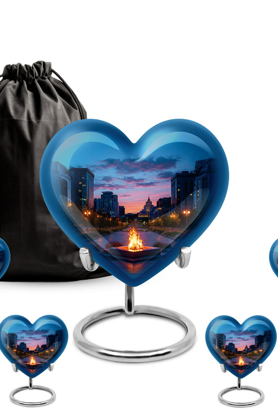 Powder Blue Campfire Cremation Urn close-up of engraving and surface detail - heart-shaped campfire design symbolizing eternal love - memorial set with one large and four small urns