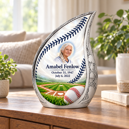 Curved Drop baseball memorial urn in a natural home setting.