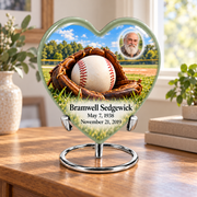 Heart baseball memorial urn in a natural home setting.