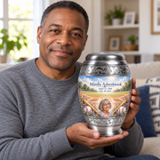An adult holding the Monar baseball memorial urn, with its personalized artwork visible.