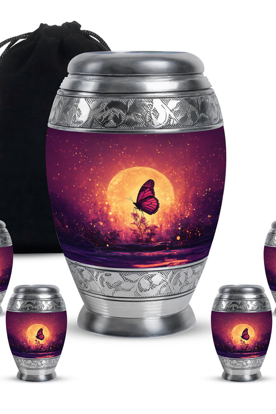 Blush Pink Butterfly Cremation Urn detail view - ornate monarch-style butterfly relief on brushed aluminum - memorial set with one large and four small urns