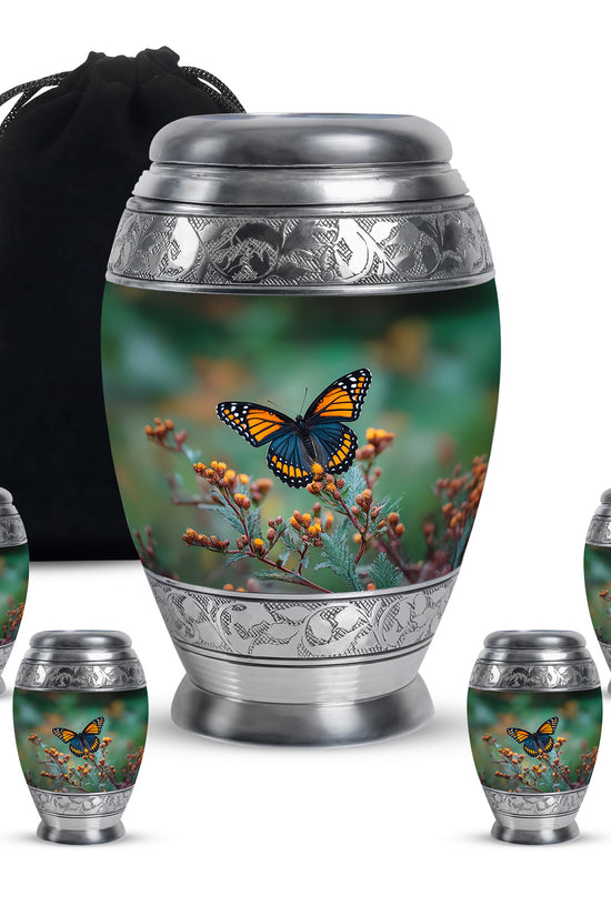 Mint Green Butterfly Cremation Urn detail view - majestic butterfly pattern with filigree border - memorial set with one large and four small urns