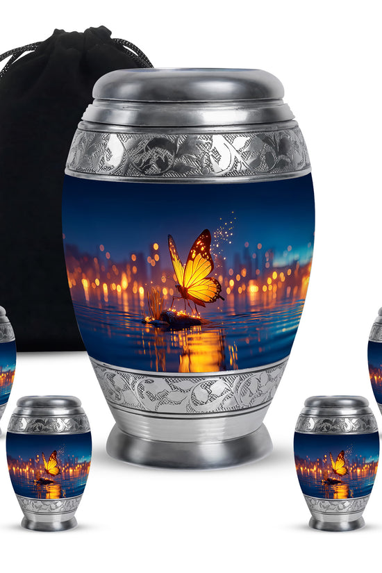 Pastel Blue Butterfly Cremation Urn detail view - ornate monarch-style butterfly relief on brushed aluminum - memorial set with one large and four small urns